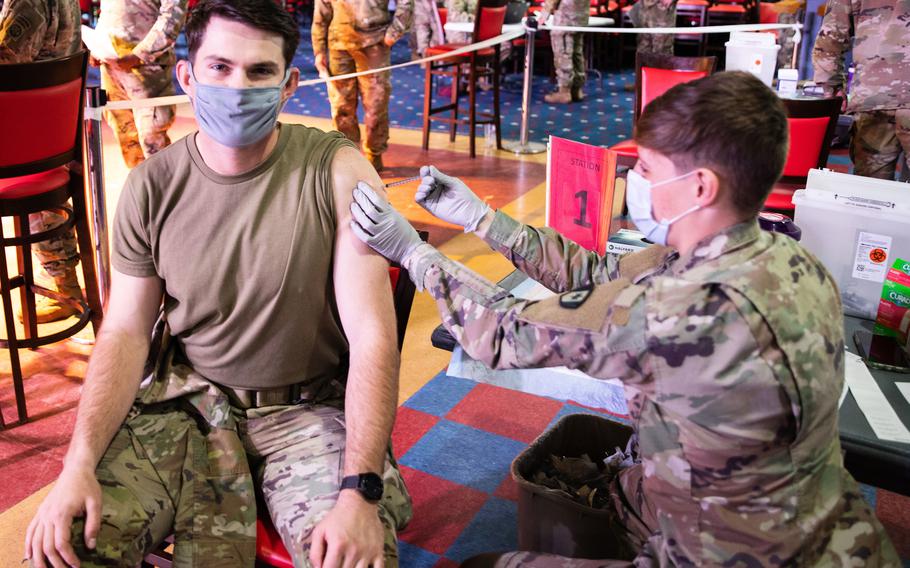 120p na            A Paratrooper assigned to the 82nd Airborne Division receives the COVID-19 vaccination at Sports USA on Fort Bragg, N.C., January 14, 2021.