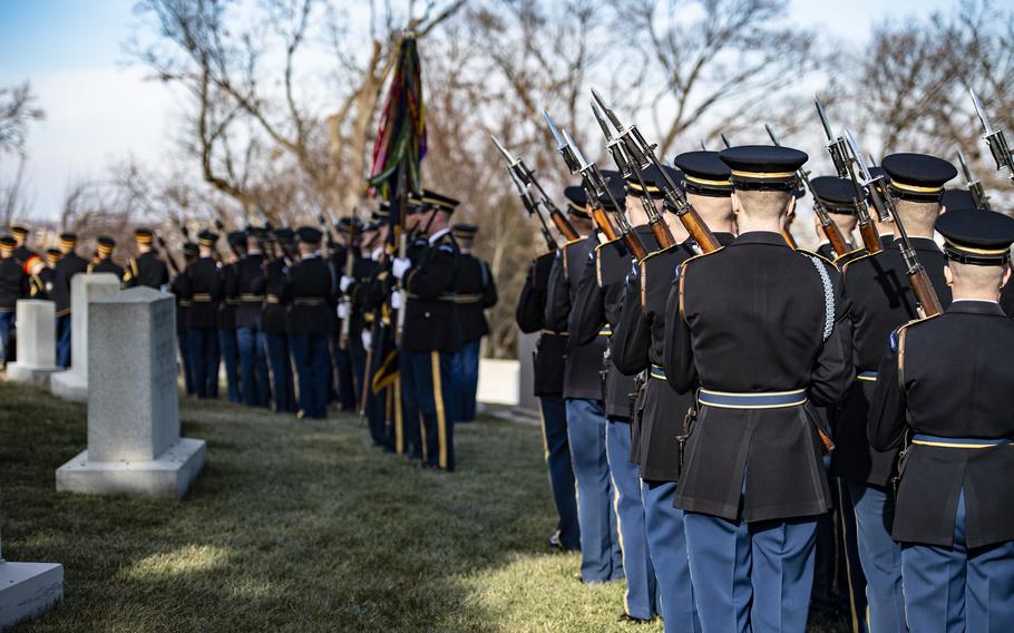 Members of the 3d U.S. Infantry Regiment (The Old Guard), the U.S. Army Band, “Pershing’s Own,” and the 3d U.S. Infantry Regiment Caisson Platoon conduct military funeral honors at Arlington National Cemetery, Arlington, Va., Feb. 2, 2022, during the funeral service of former Sen. Robert Dole.