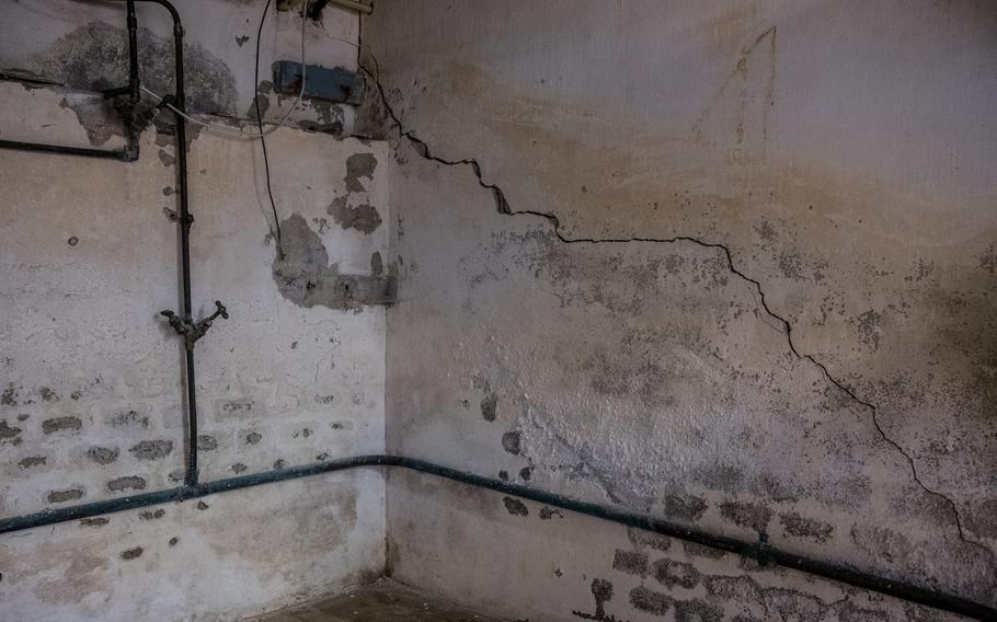 Cracks caused by the earthquakes streak across the basement of Annette Sins's home in Loppersum.