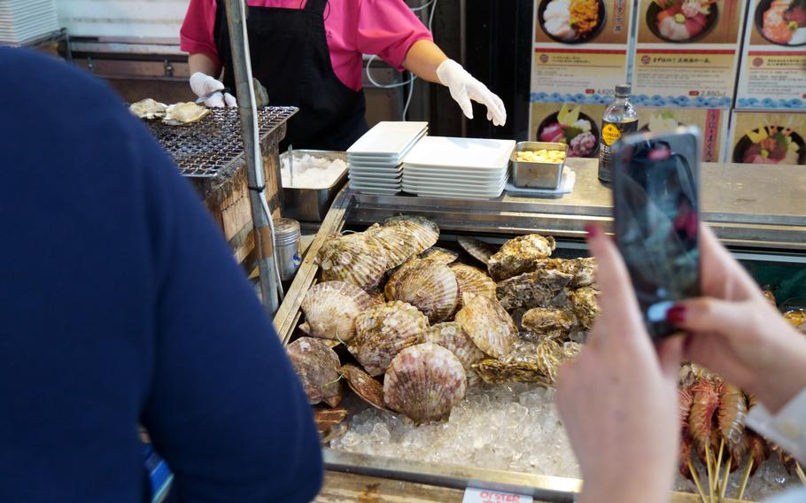 Scallops and other Japanese seafood is sold at Tsukiji outer market in Tokyo, Tuesday, Oct. 31, 2023.