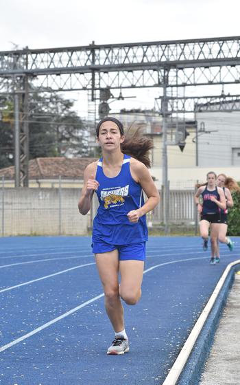 Sigonella's Amelia Cantwell had a good lead for much of the 1,600-meter run Saturday, April 23, 2022, before holding off Aviano's Autumn Thomas at the end to win in Pordenone, Italy.
