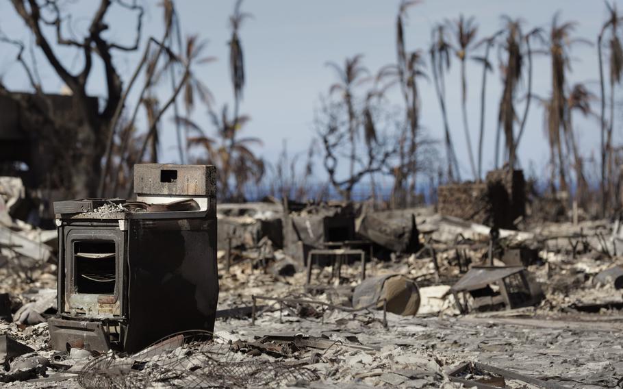 A cook stove stands out on a charred landscape in a neighborhood destroyed by a wildfire in Lahaina, Hawaii, August 17, 2023. 