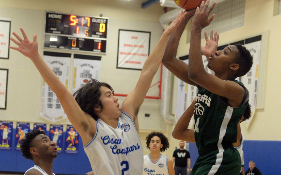 Senior Adam Rutland, center, has been named one of three Osan student-athletes of the year.