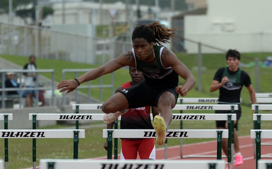 Carlos Cadet clears a hurdle.