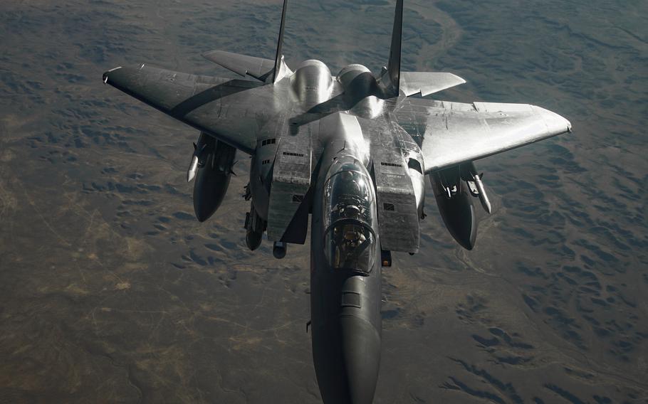 An Air Force F-15E Strike Eagle prepares to depart after receiving fuel from a KC-135 Stratotanker during a mission supporting Combined Joint Task Force - Operation Inherent Resolve over the U.S. Central Command area of responsibility on Feb. 9, 2021. 