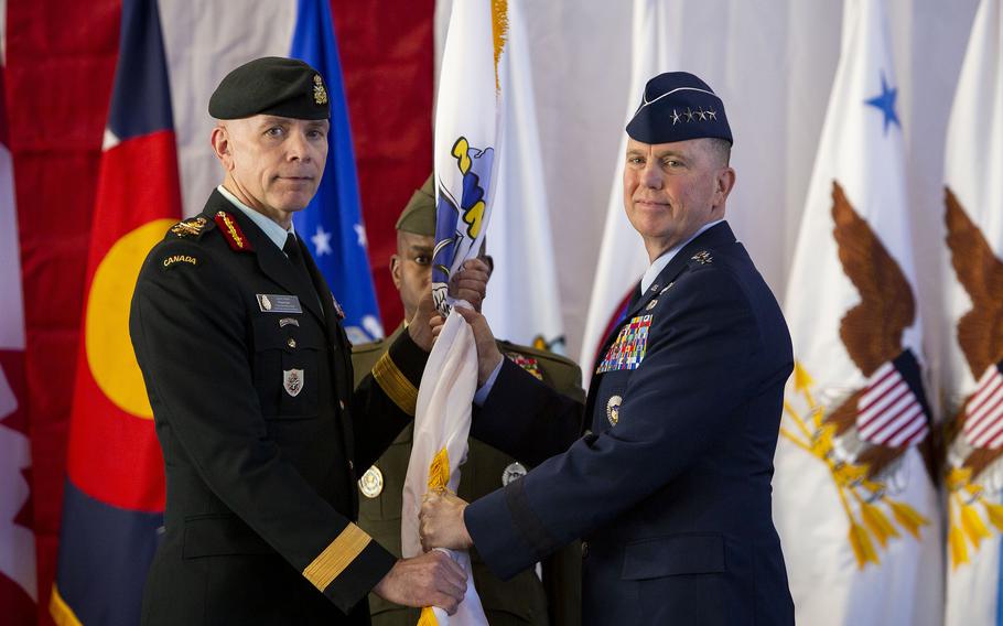 Gen. Gregory M. Guillot accepts command of North American Aerospace Defense Command from Canadian Armed Forces Chief of the Defence Staff Wayne D. Eyre during a change of command ceremony at Peterson Space Force Base, Colo., Monday, Feb. 5, 2024. Also pictured is NORAD and NORTHCOM Command Senior Enlisted Leader Sgt. Maj. James Porterfield.