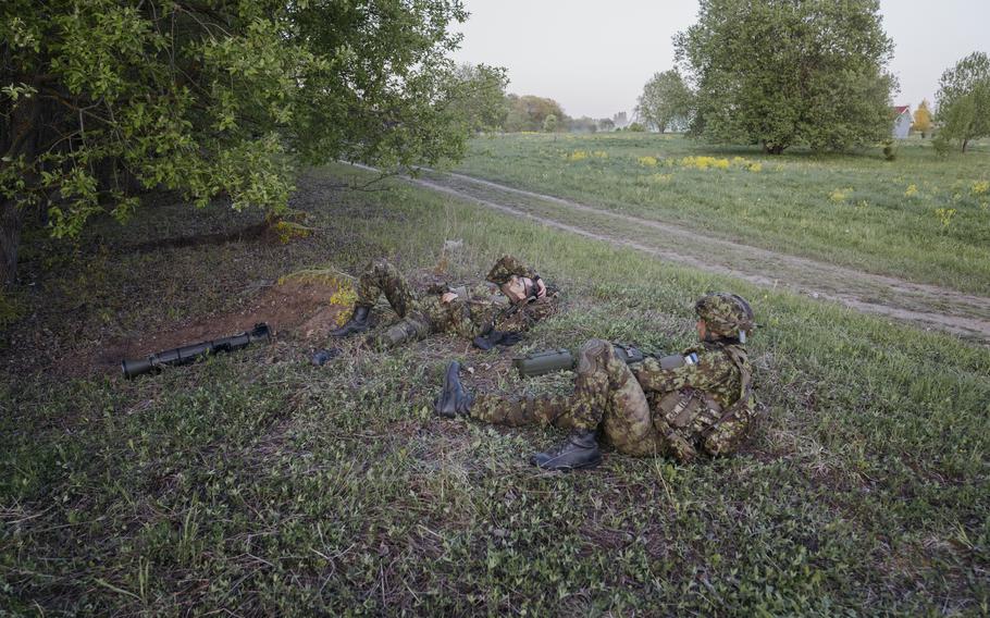 Estonian soldiers take a break during the training. 