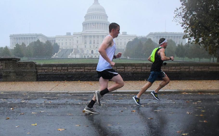 Runners in the 2019 Marine Corps Marathon pass the U.S. Capitol in Washington, D.C., at about 19 miles into the 26.2-mile race. 