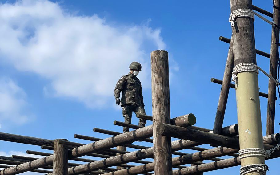 Cadets from the Korean Military Academy take on an obstacle course at Camp Humphreys, South Korea, Feb. 16, 2022. 