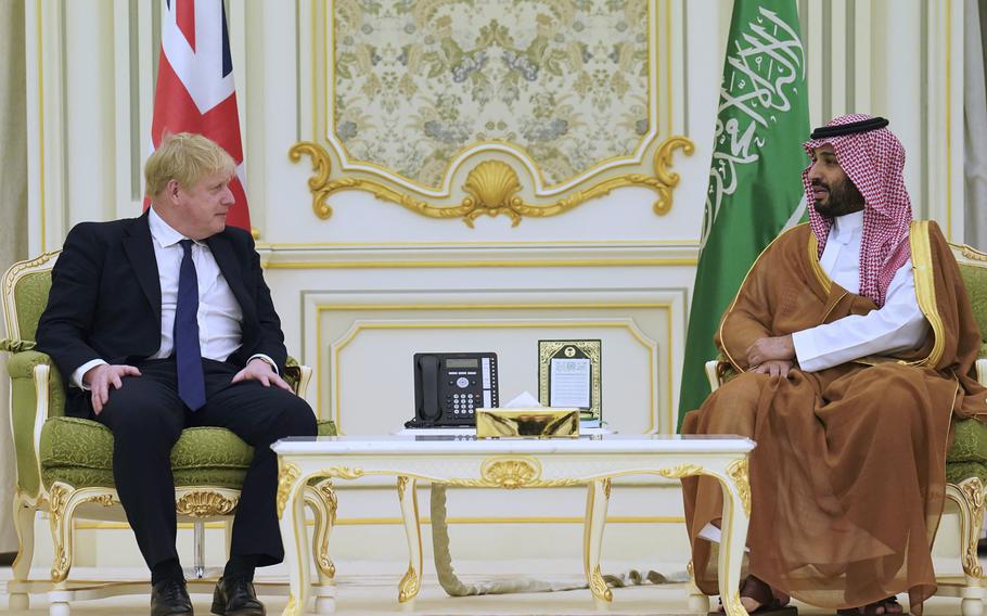 Britain’s Prime Minister Boris Johnson, left, sits with Mohammed bin Salman, right, Crown Prince of Saudi Arabia ahead of a meeting at the Royal Court in Riyadh, Saudia Arabia, Wednesday March 16, 2022.