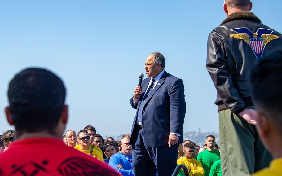 Navy Secretary Carlos Del Toro addresses sailors of USS Carl Vinson in San Diego on May 4, 2022.  Del Toro said climate change is a threat that increases instability and demands on U.S. forces and affects their capacity to respond to those demands.