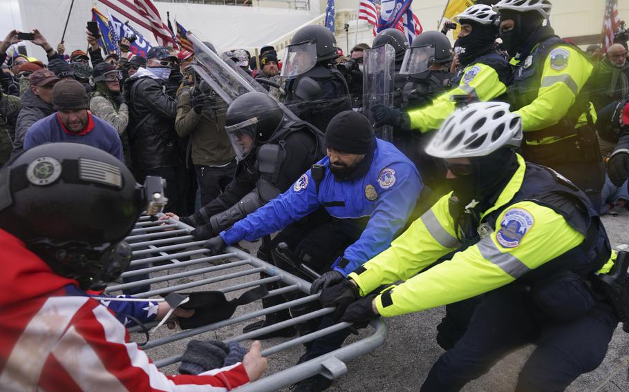 Rioters at the U.S. Capitol on Jan. 6, 2021, in Washington. A former top editor of an Orthodox Jewish newspaper in New York City was arrested Thursday on charges that he interfered with police officers who were trying to protect the U.S. Capitol during the Jan. 6 riot. Elliot Resnick was chief editor of The Jewish Press when he joined the crowd of Donald Trump supporters who stormed the Capitol on Jan. 6, 2021, according to an FBI agent’s affidavit. 