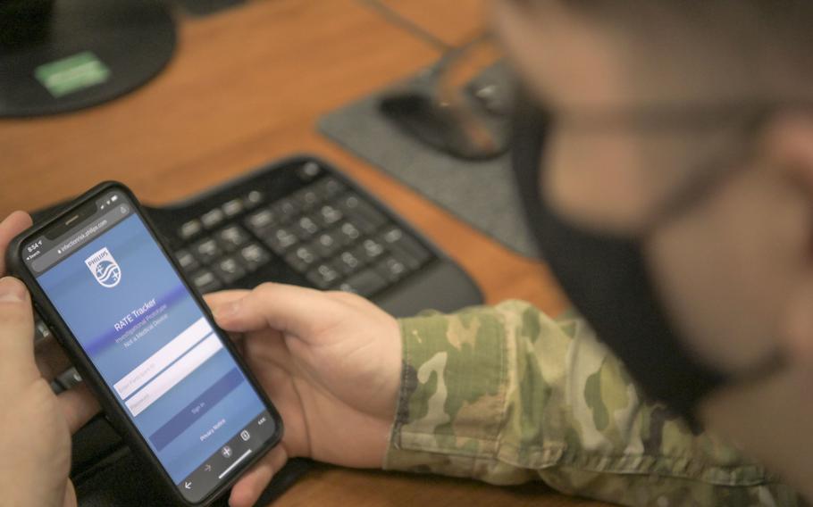 An airman from the 18th Component Maintenance Squadron prepares to login to the Rapid Analysis of Threat Exposure app at Kadena Air Base, Japan, April 29, 2021. The RATE app is used to securely monitor the user’s health biometrics such as their sleep data and respiratory rate.