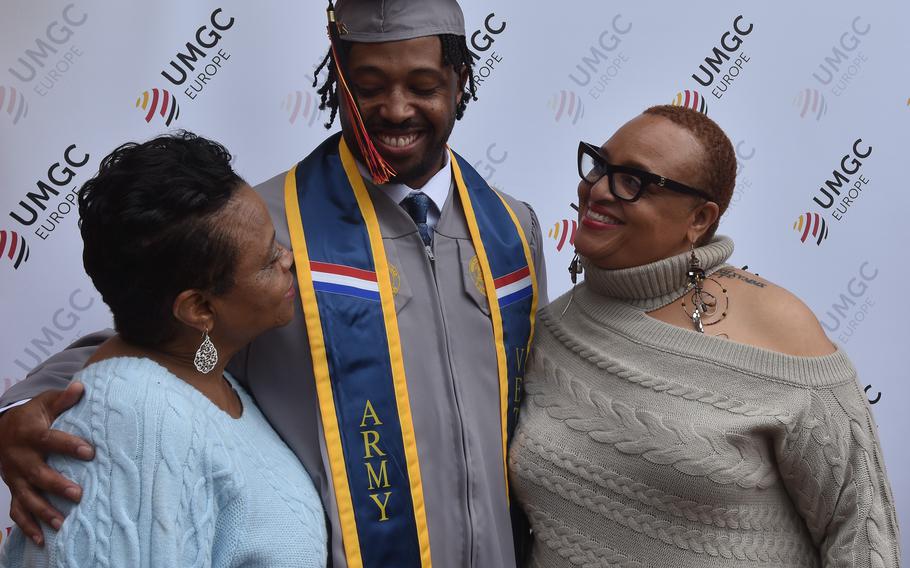 Annette Gary, left, and Monica Brady traveled from the United States to see Joseph Gary, their son and brother, respectively, receive his associate’s degree in criminal justice at the University of Maryland Global Campus Europe commencement on Saturday, April 27, 2024, at Ramstein Air Base, Germany. “We made the journey to be part of this moment for him,” Gary said of her son, an Army veteran who lives and works in Stuttgart, Germany.