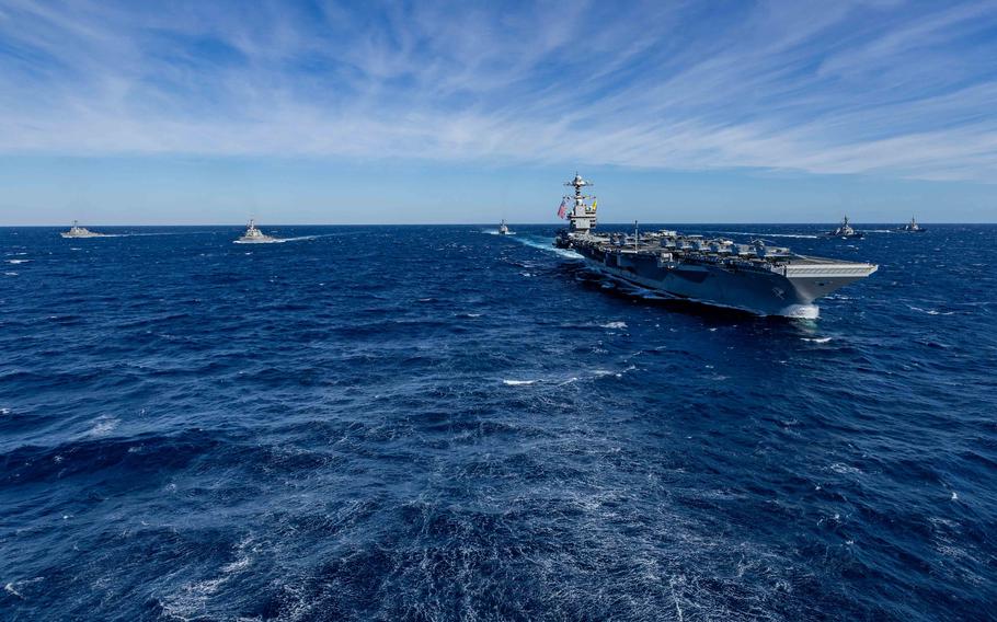 Ships at sea cruising in formation.