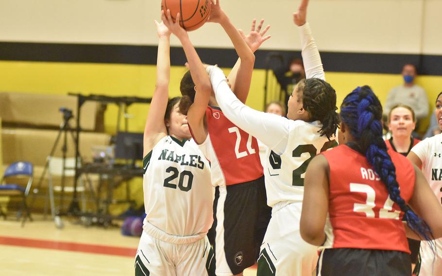 Naples' Shardaisa Greely puts her hand in the way of American Overseas School of Rome's Lara Jaff from seeing the basket Friday, March 4, 2022, at the DODEA-Europe Division II basketball championships.