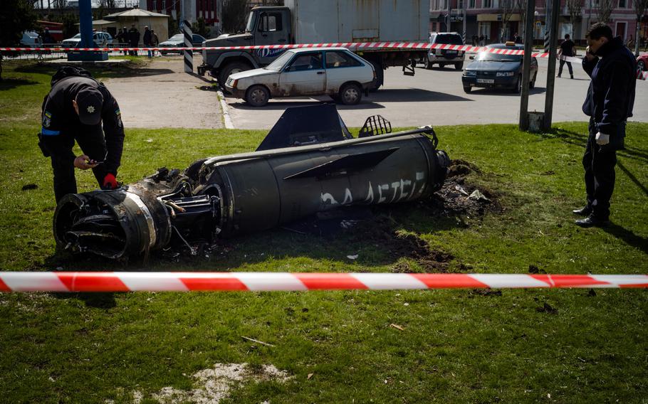 Part of a missile with the Russian words “for the children” painted on it is seen after a strike on the Kramatorsk railway station in eastern Ukraine on April 8, 2022. 