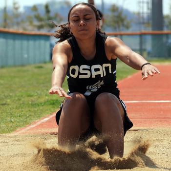 Osan sophomore Alexis Jeffress jumps to victory in 9.08 meters in the triple jump during Saturday’s DODEA-Korea track and field meet at Humphreys. Jeffress also won the long jump.