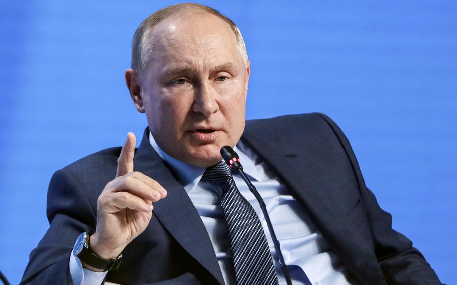 Russian President Vladimir Putin gestures while speaking at the plenary session of the Russian Energy Week in Moscow, Russia, Wednesday, Oct. 13, 2021.