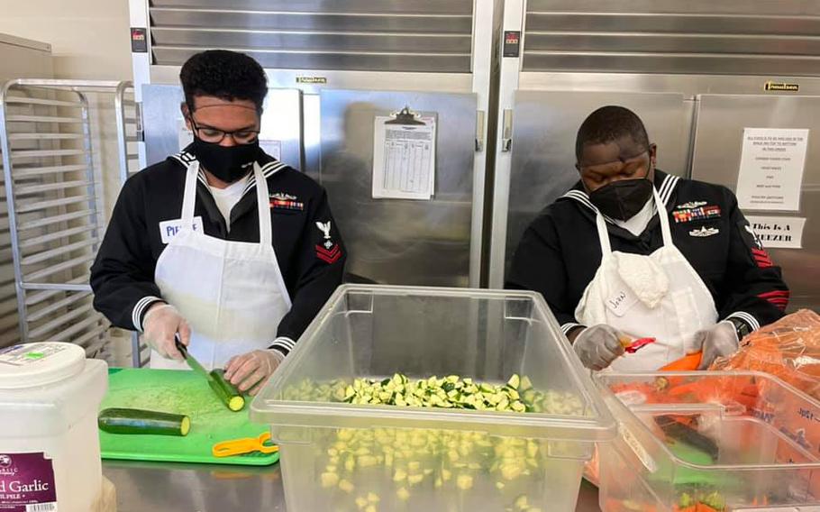 Sailors and personnel from USS Santa Fe, USS Constitution and USS Dwight D. Eisenhower helped out this week at nonprofit Kitchen Angels in Santa Fe, N.M., as part of Navy week.