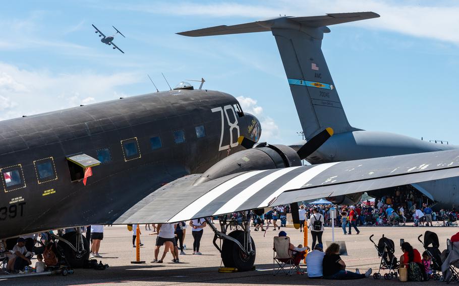 Tampa Bay AirFest guests watch a C-17 Globemaster III from Joint Base Charleston, S.C., perform an aerial display at MacDill Air Force Base, Fla., Saturday, March 30, 2024.