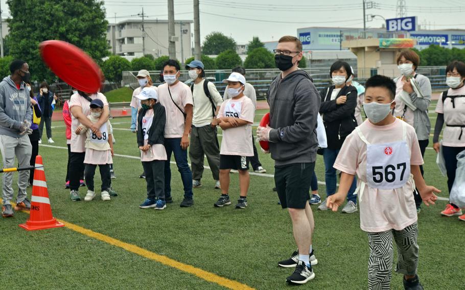 A Frisbee toss competitor takes his turn during the Kanto Plains Special Olympics at Yokota Air Base, Japan, Saturday, May 22, 2021.