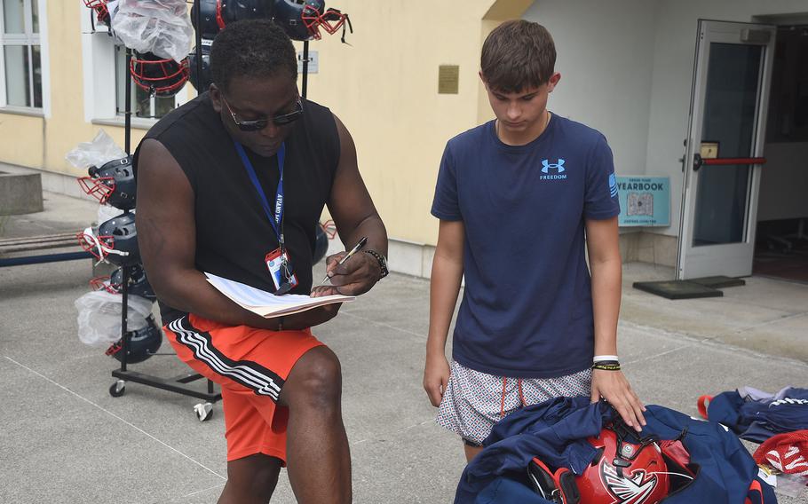 John Chance and Noah Stanley confer.
