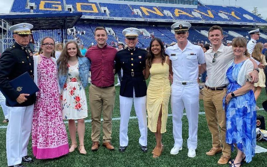 The family of retired Marine Corps Brig. Gen. Frank Kelley poses for a picture at 2nd Lt. Paul Kelley’s commissioning ceremony at the U.S. Naval Academy, Annapolis, Md.  