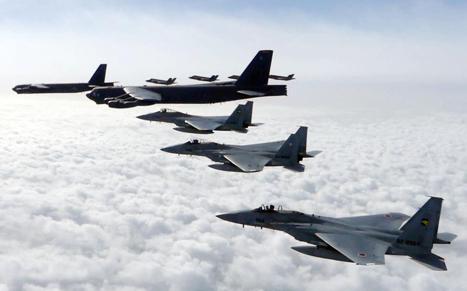 U.S. and Japanese fighter jets fly alongside B-52 bombers over the Sea of Japan, Friday, April 14, 2023.