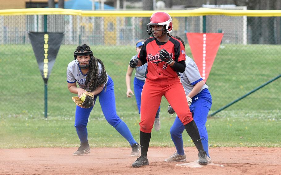 Kaiserslautern junior Loren Martin stands on second base after beating the throw from home plate during the second game of the Raiders' doubleheader on Saturday against Ramstein on Ramstein Air Base, Germany. Securing the ball at left is Royal shortstop Parker Ingram.