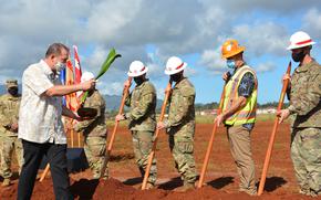 Kahu Hailama Farden performs a traditional Hawaiian blessing as o’o sticks are used to break ground for a new maintenance hangar at Wheeler Army Airfield, Hawaii, Thursday, Jan. 20, 2022.