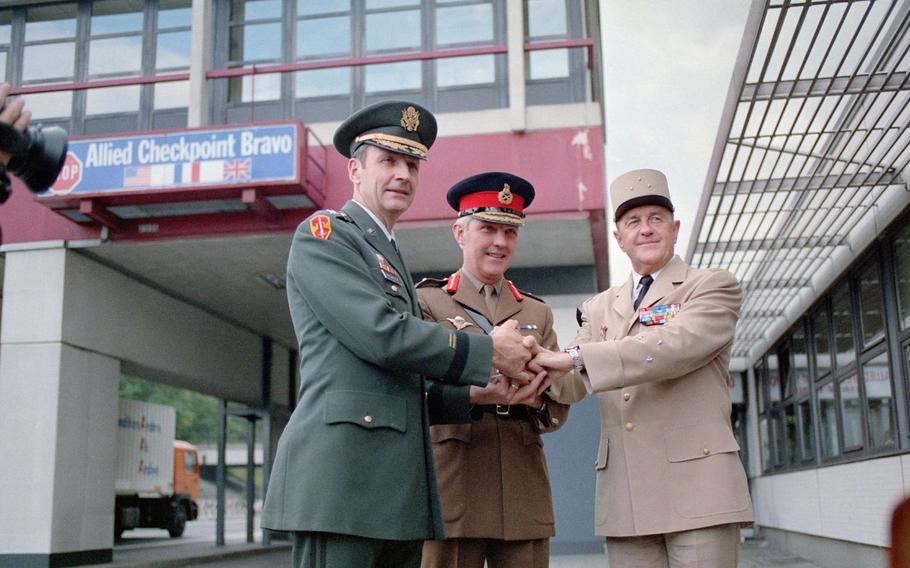 From left, Maj. Gen. Raymond Haddock, British Maj. Gen. Robert Corbett and French Divisional Gen. Francois Cann attend the closing of allied Checkpoint Bravo in Berlin on Oct. 2, 1990, one day before German reunification. 