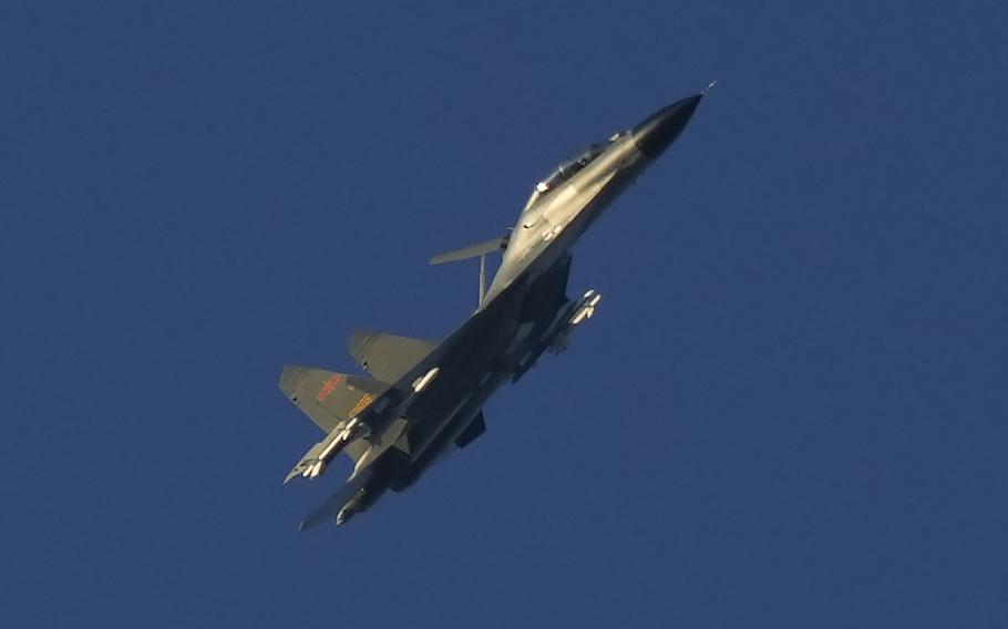 A Chinese J-11 military fighter jet flies above the Taiwan Strait near Pingtan, the closest land of mainland China to the island of Taiwan, in Pingtan in southeastern China’s Fujian Province, Friday, Aug. 5, 2022.