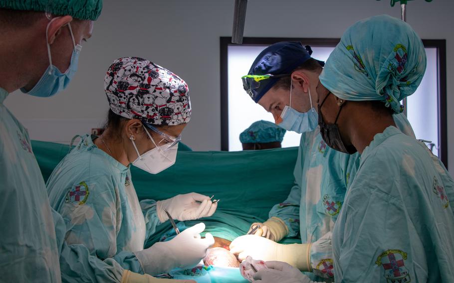 Members of the Angolan armed forces and U.S. Army medical teams perform surgery on an Angolan citizen at the Hospital Militar Principal in Luanda, Angola, in November.