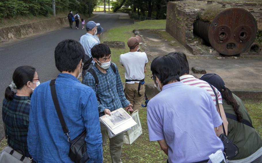 Japanese visitors take part in an "eco tour" at Tama Hills, a U.S. military recreation area in western Tokyo, Wednesday, May 26, 2021.