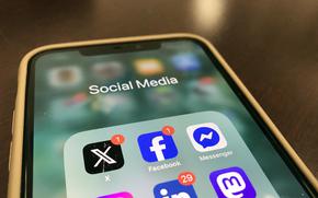 A phone screen showing multiple social media platforms.