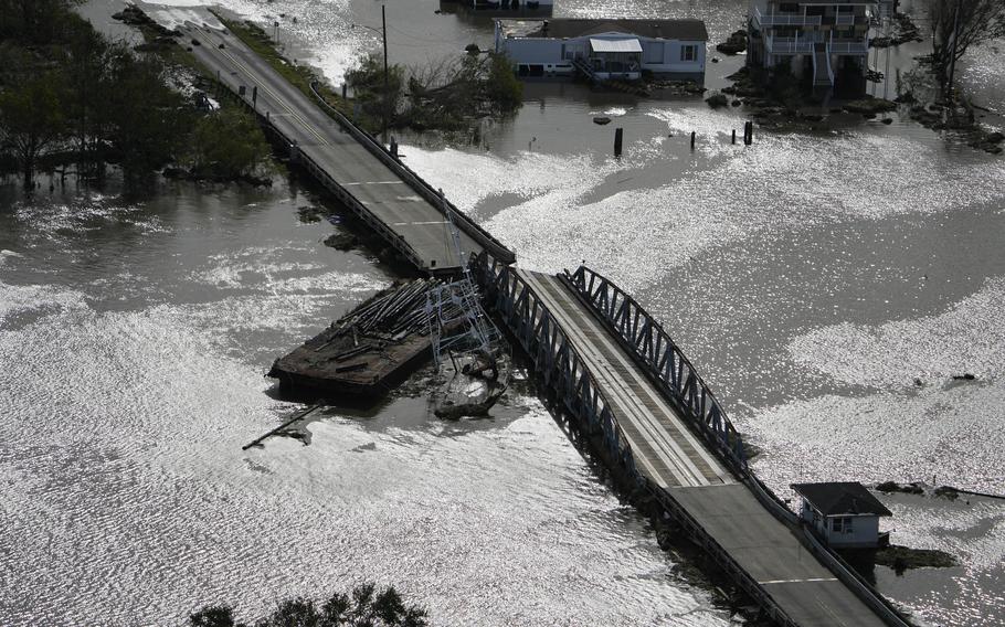 A barge damages a bridge that divides Lafitte, La., and Jean Lafitte, in the aftermath of Hurricane Ida, Monday, Aug. 30, 2021, in Lafitte, La. 