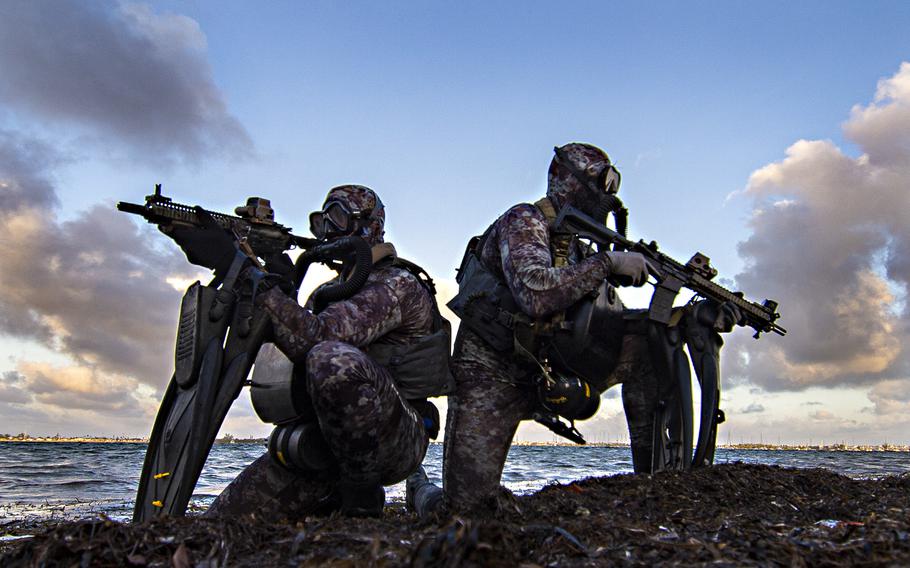 Navy SEAL members assigned to Naval Special Warfare Group 2 conduct military dive operations off the East Coast of the United States.