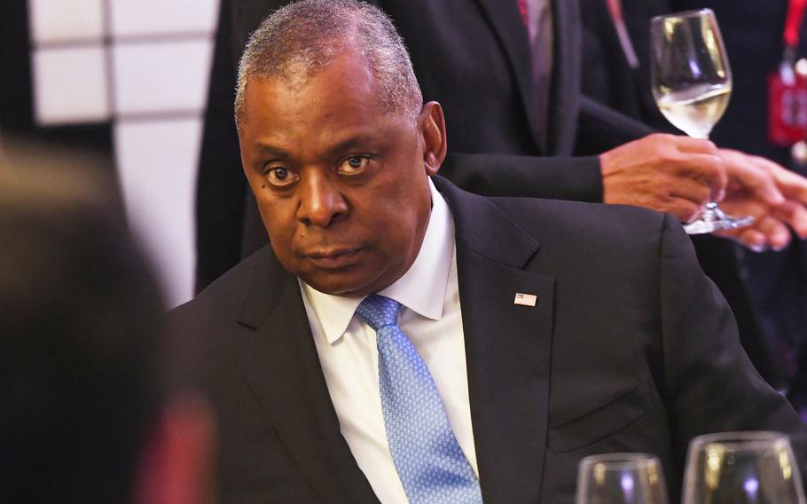 U.S. Defense Secretary Lloyd Austin listens to China’s Defense Minister Wei Fenghe at the ministerial roundtable luncheon at the Shangri-La Dialogue summit in Singapore on Saturday, June 11, 2022. 