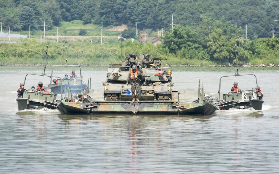 A South Korean K1A2 tank crosses a reservoir during "wet gap" training in Cheorwon county, near the Demilitarized Zone, Thursday, Aug. 31, 2023.