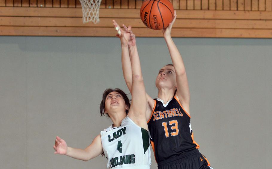 Ankara’s Nino Jabanashvili, left, defends against Spangdahlem’s Isabel Bodily in a D-III game on opening day of the DODEA-Europe basketball finals in Baumholder, Germany, Feb. 15, 2023. Spangdahlem won 39-6.