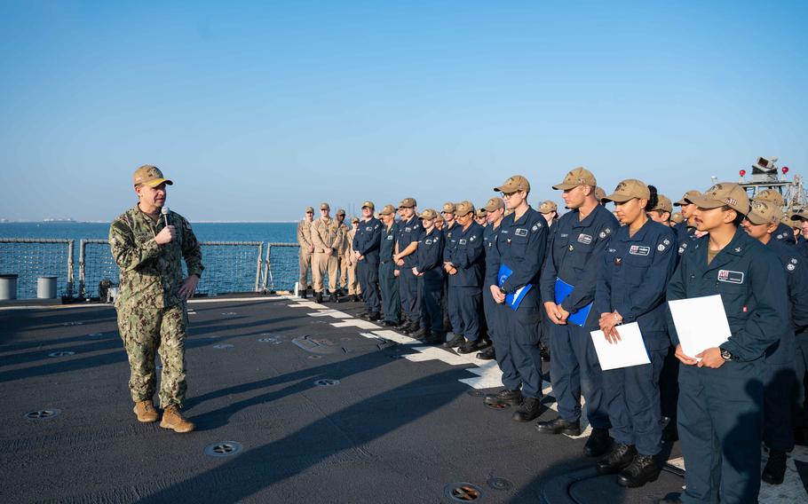 Vice Adm. Brad Cooper, commander of U.S. 5th Fleet at the time, speaks with sailors assigned to the Arleigh Burke-class, guided-missile destroyer USS Carney after presenting combat medals to sailors while the ship was in Bahrain on Jan. 2, 2024. 