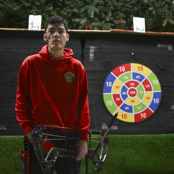 A Marine Corps veteran  standing after archery practice.