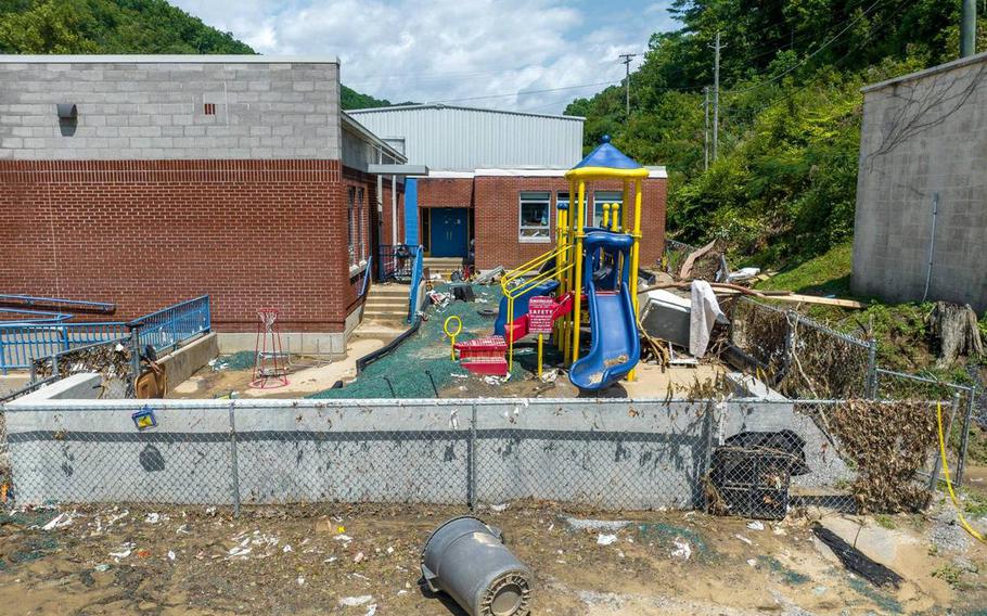 Mud and debris surround a playground outside Robinson Elementary School near Ary in Perry County, Ky., on Aug. 2, 2022.