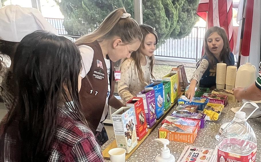 Troops members gear up to sample Girl Scout Cookies at Yokota Air Base, Japan, Feb. 4, 2023.