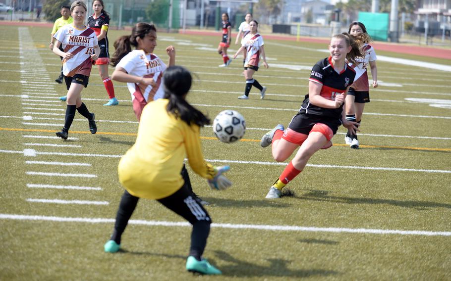 E.J. King’s Madylyn O’Neill launches a shot at Marist Brothers keeper Sneha Shah.