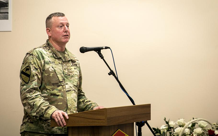 Brig. Gen. Eric Riley, deputy commanding general of the U.S. Army's 10th Mountain Division, speaks at a ceremony Oct. 27, 2023, dedicating the dining facility at Camp Kosciuszko in Poznan, Poland, to the memory of Staff Sgt. Michael Ollis. U.S. and Polish troops gathered with the Ollis family to unveil a portrait and memorial plaque honoring an American soldier who gave his life to save a Polish counterpart in Afghanistan.