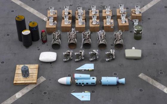 This undated photograph released by the U.S. military's Central Command shows what is described as Iranian-made missile components bound for Yemen's Houthi seized off a vessel in the Arabian Sea.