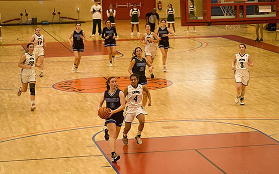 Brussels’ Tessa Wedekind drives for a fast break layup during a DODEA-Europe Division III basketball semifinal game Friday, Feb. 17, 2023, in Baumholder, Germany.