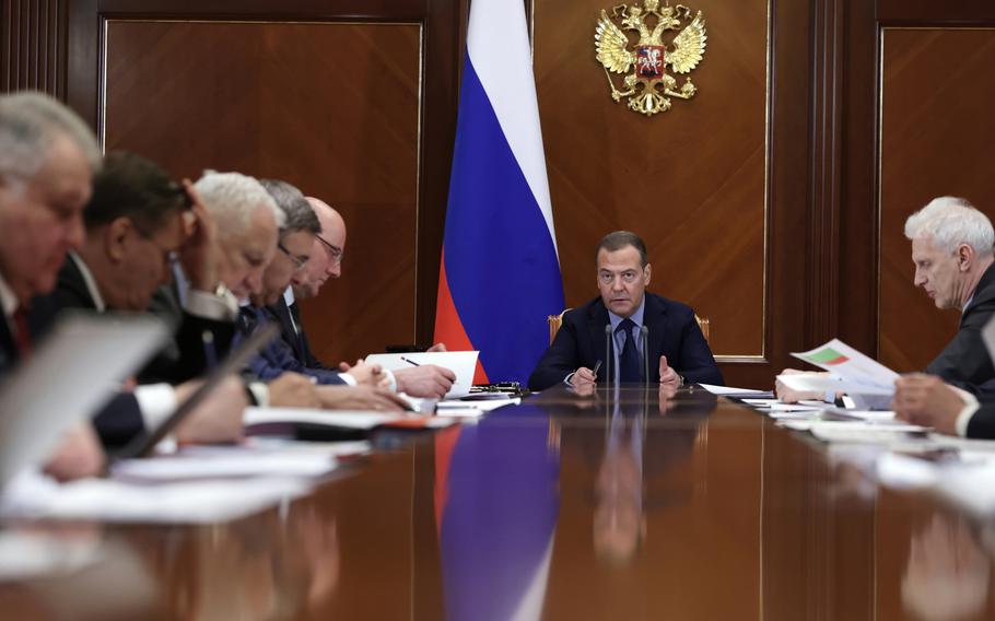 Deputy chairman of Russia’s Security Council Dmitry Medvedev, center, chairs a meeting of the Presidium of the Presidential Council for Science and Education at Gorki state residence, outside Moscow, Jan. 20, 2023. Medvedev this week suggested on Twitter that three independent Baltic nations belong to Russia. 